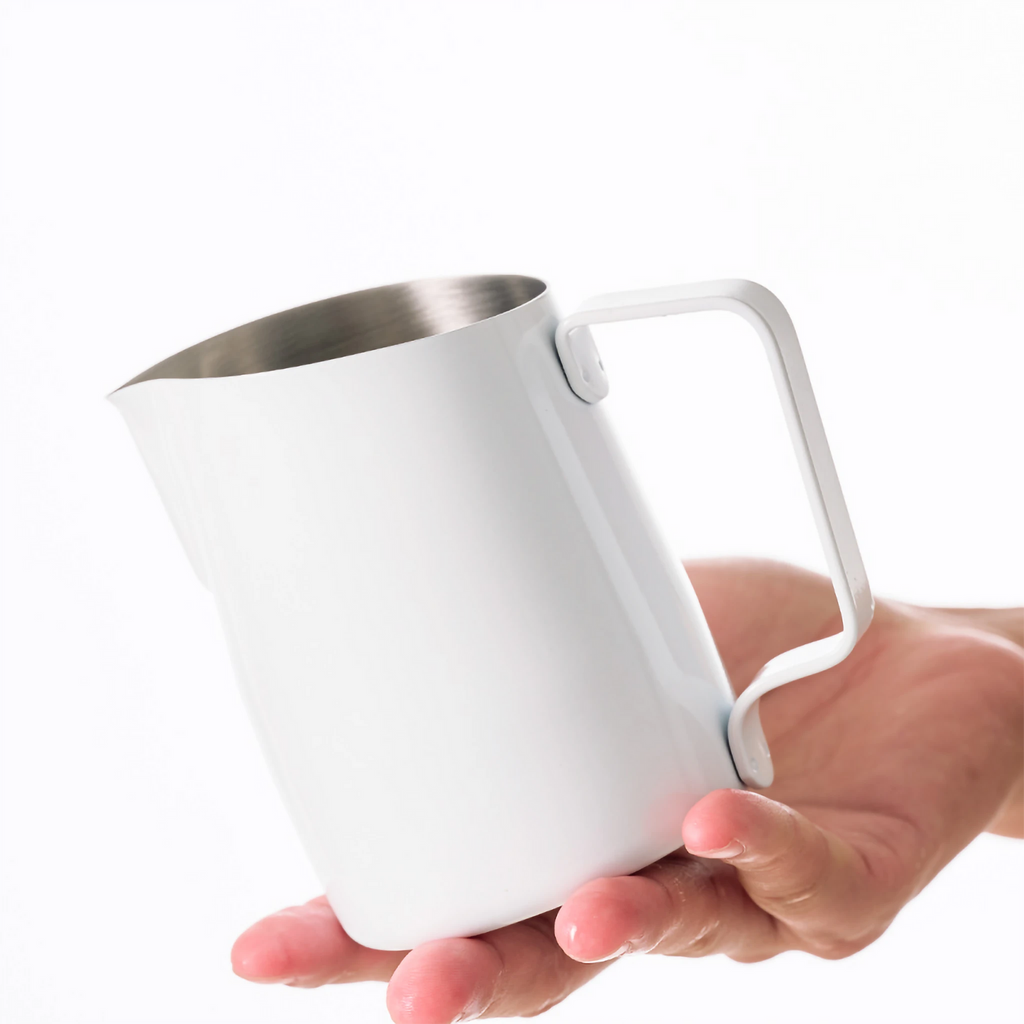 WPM Latte Art Milk Pitcher — in-use angle